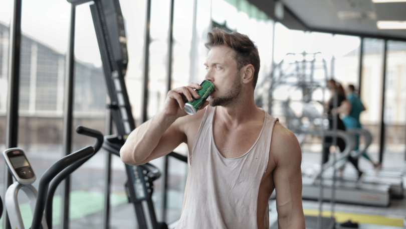 man drinking energy drink
